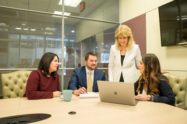 attorneys working together in a board room