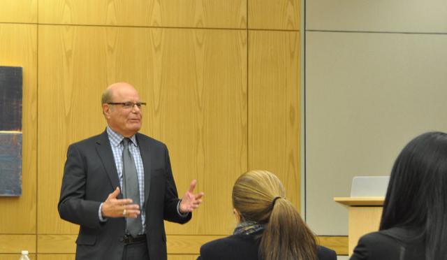 Terry Gilbert in classroom with law students